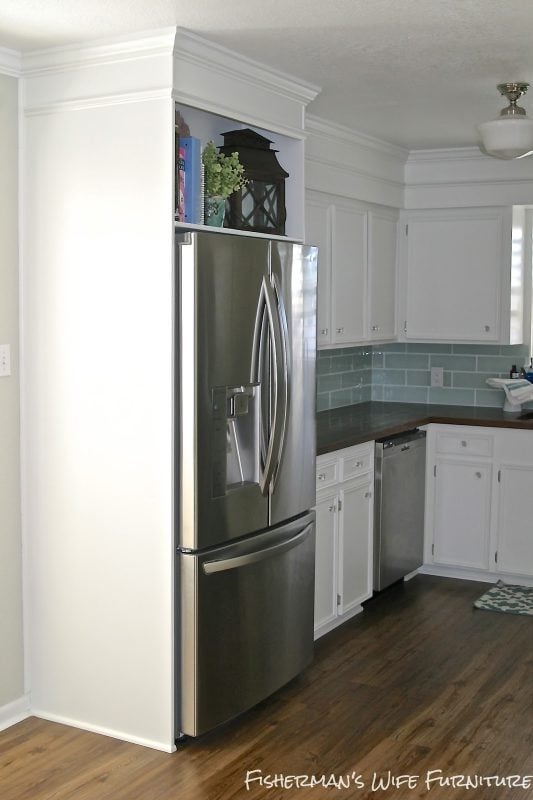 fridge enclosure - vinyl plank flooring - white cabinets - kitchen makeover, Fisherman's Wife Furniture featured on Remodelaholic.com