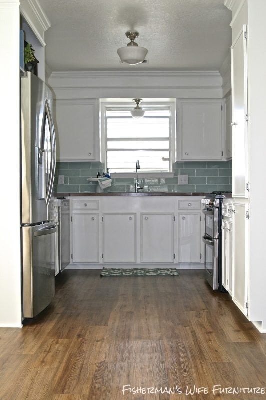 luxury vinyl plank flooring in a small kitchen remodel, Fisherman's Wife Furniture featured on Remodelaholic.com