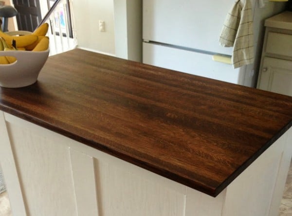 new butcher block top for the board and batten kitchen island, featured on Remodelaholic