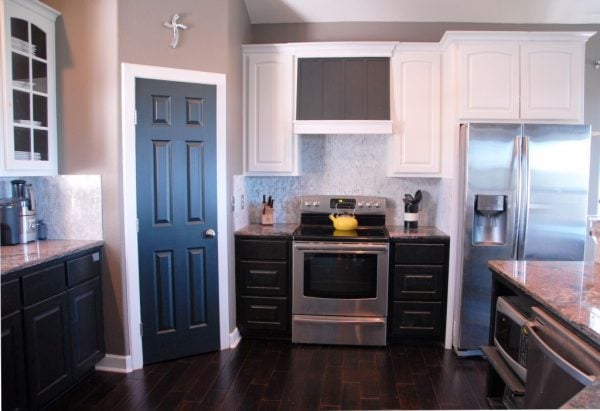 kitchen after painted cabinets and custom range hood, The Rozy Home featured on Remodelaholic