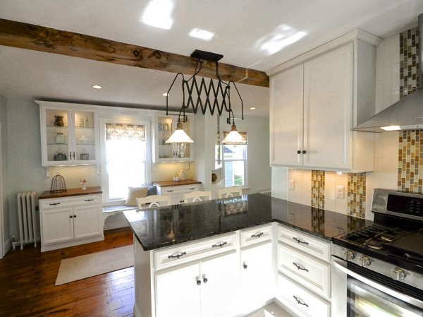 white new englander kitchen update with wood floors, SoPo Cottage featured on Remodelaholic