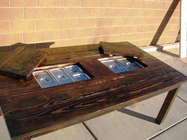 Patio table with built in stream trays featured on @Remodelaholic