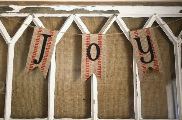 A Diamond in the Stuff -- old window with burlap for mantel - via Remodelaholic