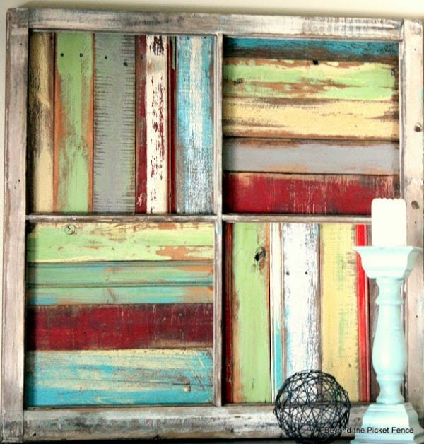 Beyond The Picket Fence - salvaged window into wood scrap wall art - via Remodelaholic