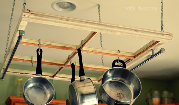 The Frugal Girls - old window into a kitchen pot rack - via Remodelaholic