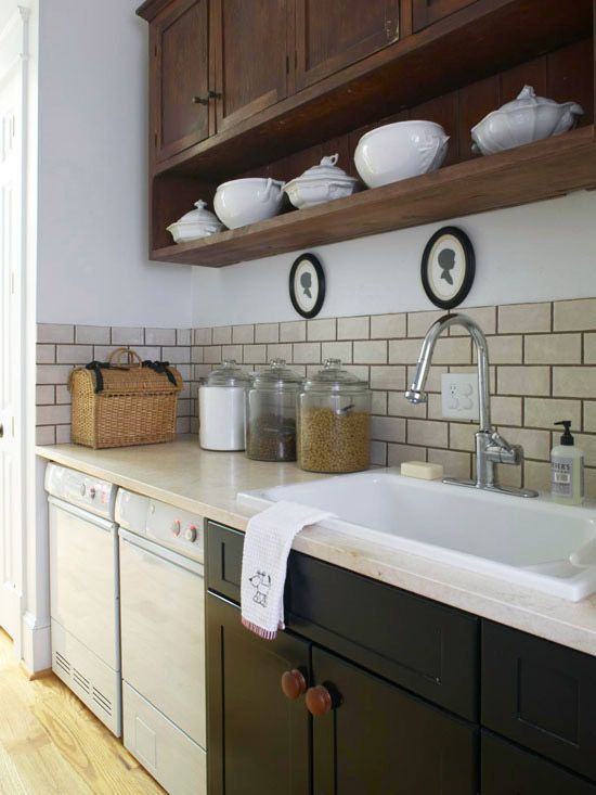 Formal pretty storage in Laundry room featured on Remodelaholic.com