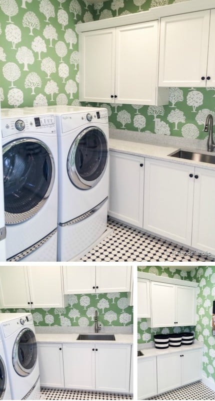 Cute laundry room with fun wallpaper and great storage featured on Remodelahlic.com
