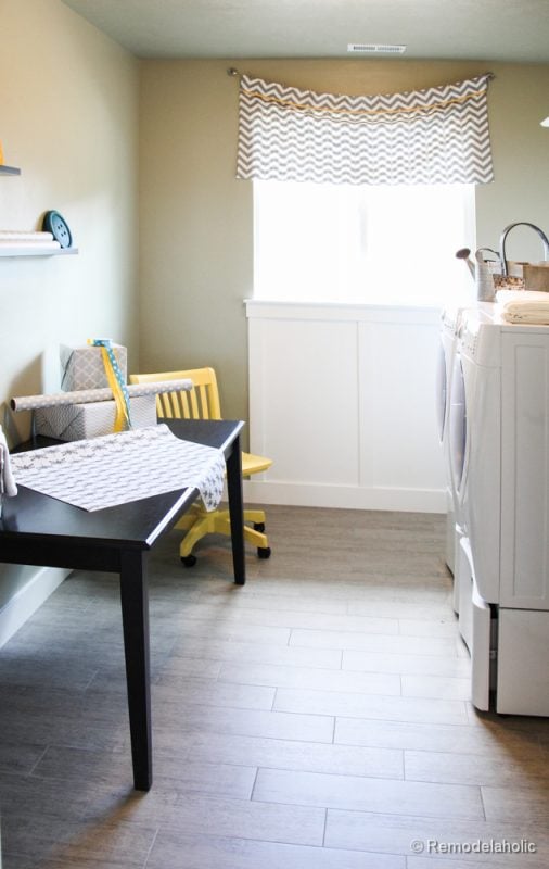 Add a table or desk to a laundry room to add a work station area. Fabulous Laundry room design ideas from @Remodelaholic