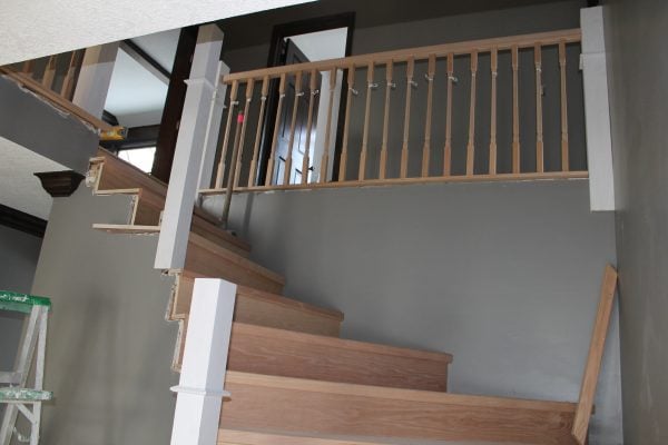 replacing stair handrail with wood posts - Construction2Style via @Remodelaholic